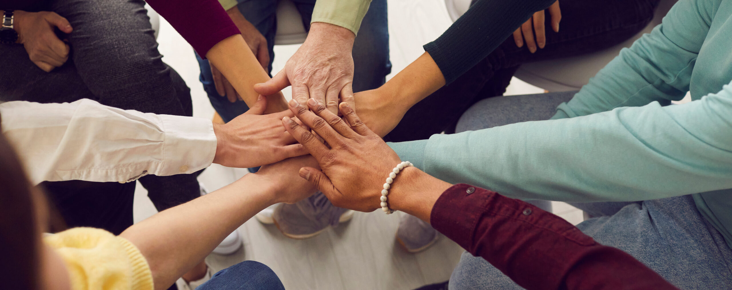 People,Of,Different,Ages,And,Nationalities,Fold,Their,Hands,On